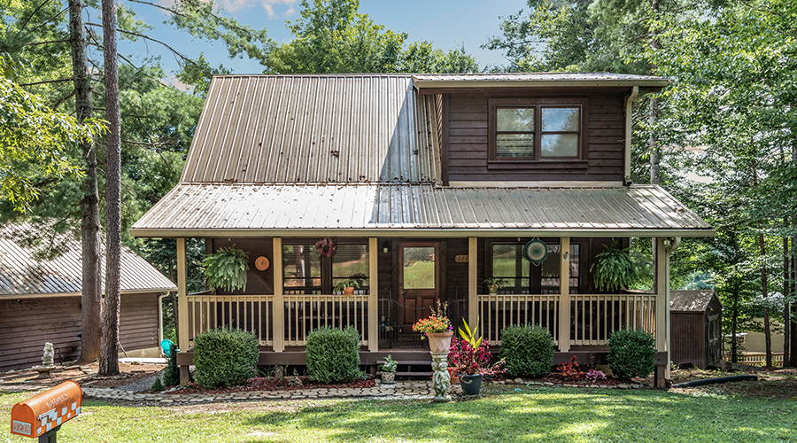 Beautiful log cabin style home with metal roofing
