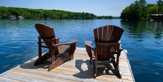 Beach chairs on deck overlooking lake