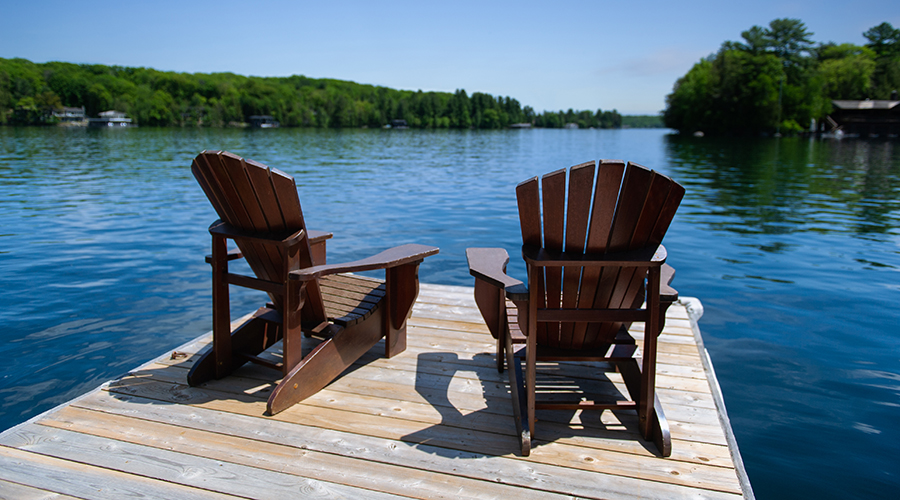 Beach chairs on deck overlooking lake