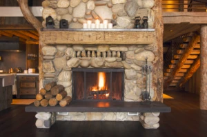 rustic stone fireplace in a cabin