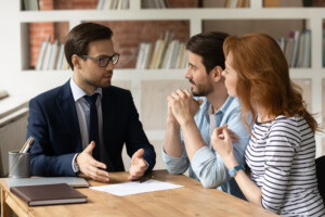 Couple meeting with mortgage loan officer