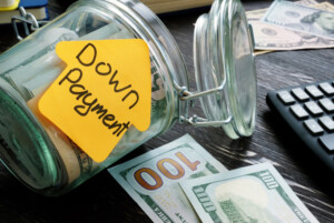 Jar of cash labeled "down payment"